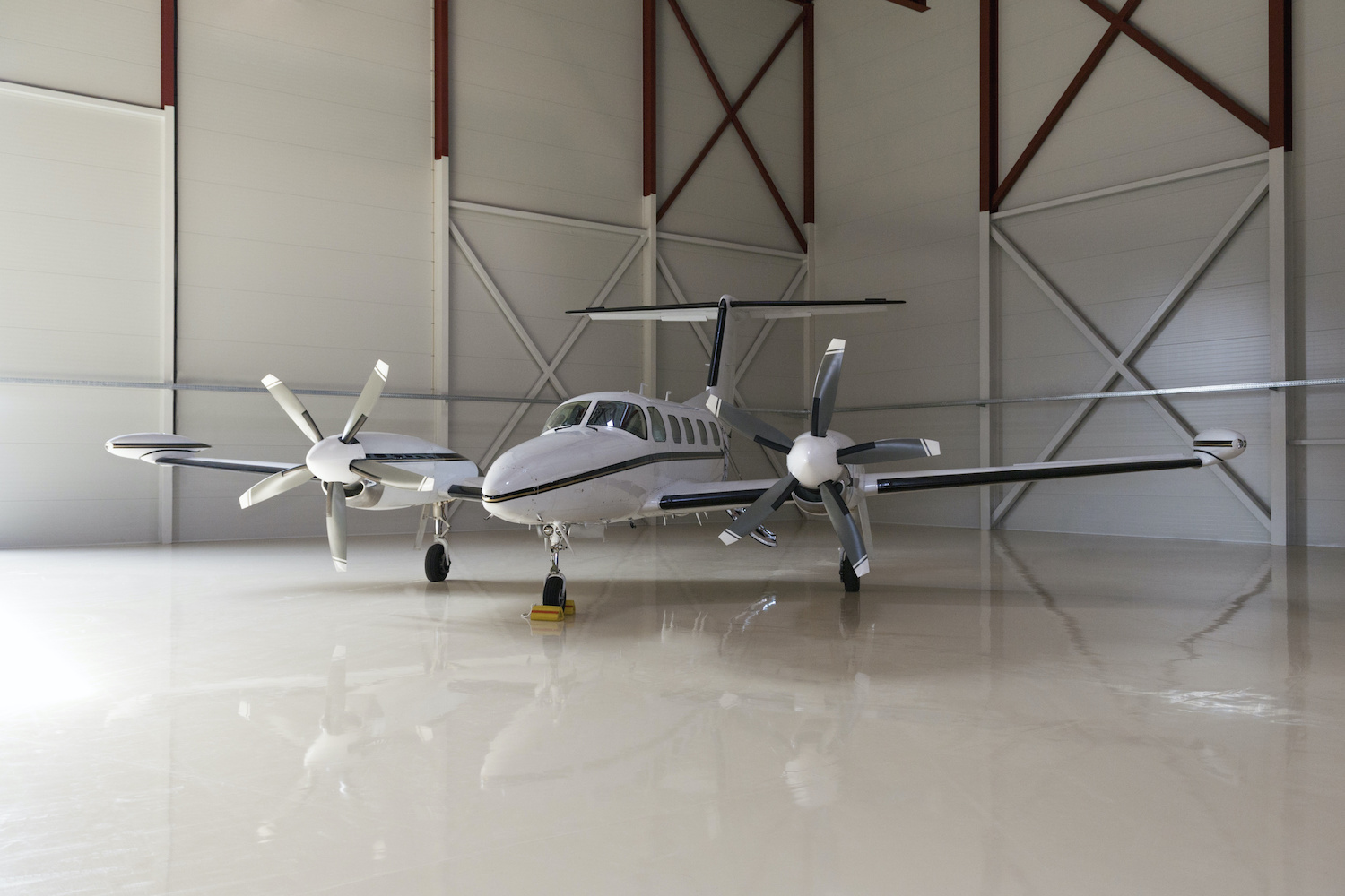 Multi-engine airplane in a hangar